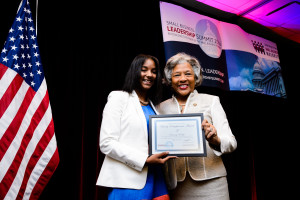 Representative Joyce Beatty (OH-3rd) presenting Dominiq Dudley the Rising Entrepreneur award for READY Publication in Columbus, OH.